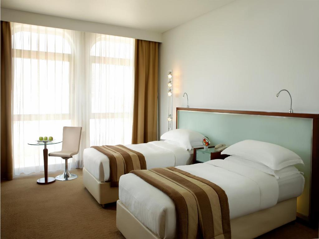 Студио (Классический номер-студия с 2 односпальными кроватями) апарт-отеля Villa Rotana - Dubai, Дубай