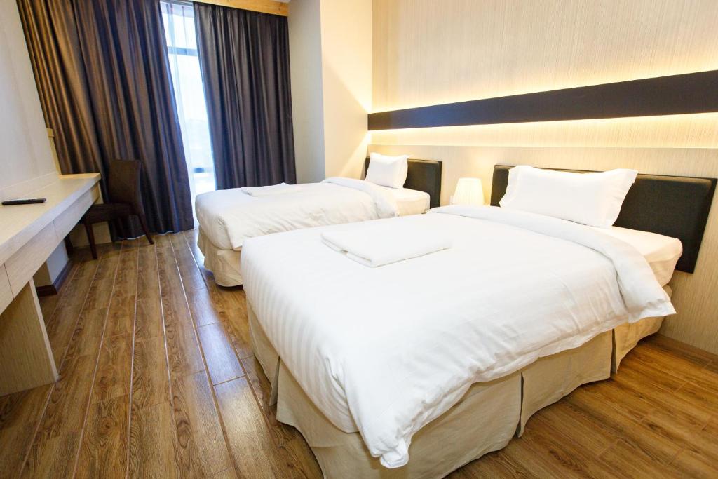 Двухместный (Двухместный номер Делюкс с 2 отдельными кроватями) отеля Lintas Platinum Hotel, Кота-Кинабалу