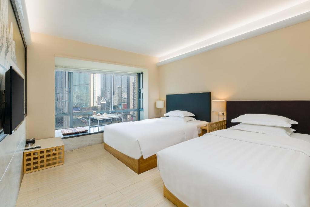 Двухместный (Улучшенный двухместный номер с 2 отдельными кроватями) отеля Timmy Hotel, Гуанчжоу