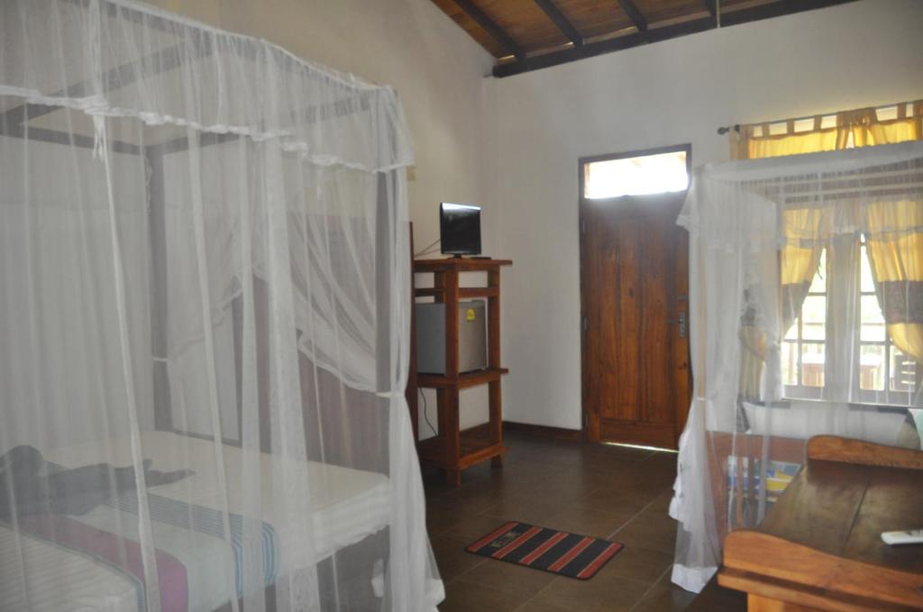 Двухместный (Двухместный номер с 2 отдельными кроватями и дополнительной кроватью) гостевого дома Beach House Habaraduwa, Коггала