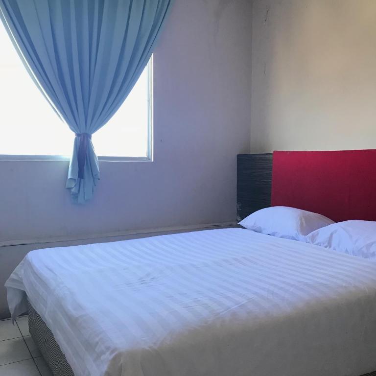 Двухместный (Стандартный двухместный номер с 1 кроватью или 2 отдельными кроватями) гостевого дома Iskandar Sinsuran Guesthouse, Кота-Кинабалу