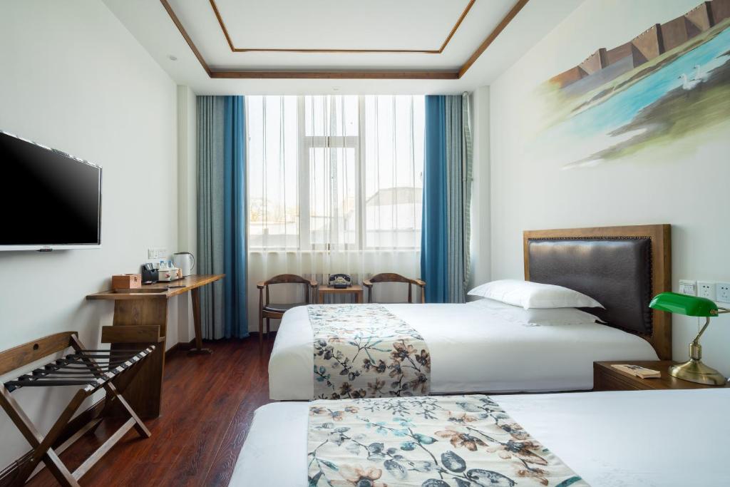 Двухместный (Улучшенный двухместный номер бизнес-класса с 2 отдельными кроватями) отеля Nostalgia Hotel Temple of Heaven, Пекин