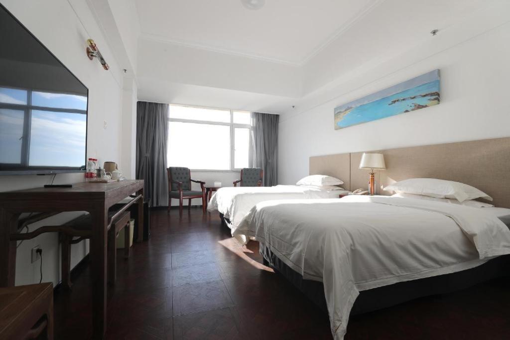 Двухместный (Двухместный номер с 2 отдельными кроватями и видом на море) отеля Weihai Xuefu Hotel Golden Beach, Вэйхай