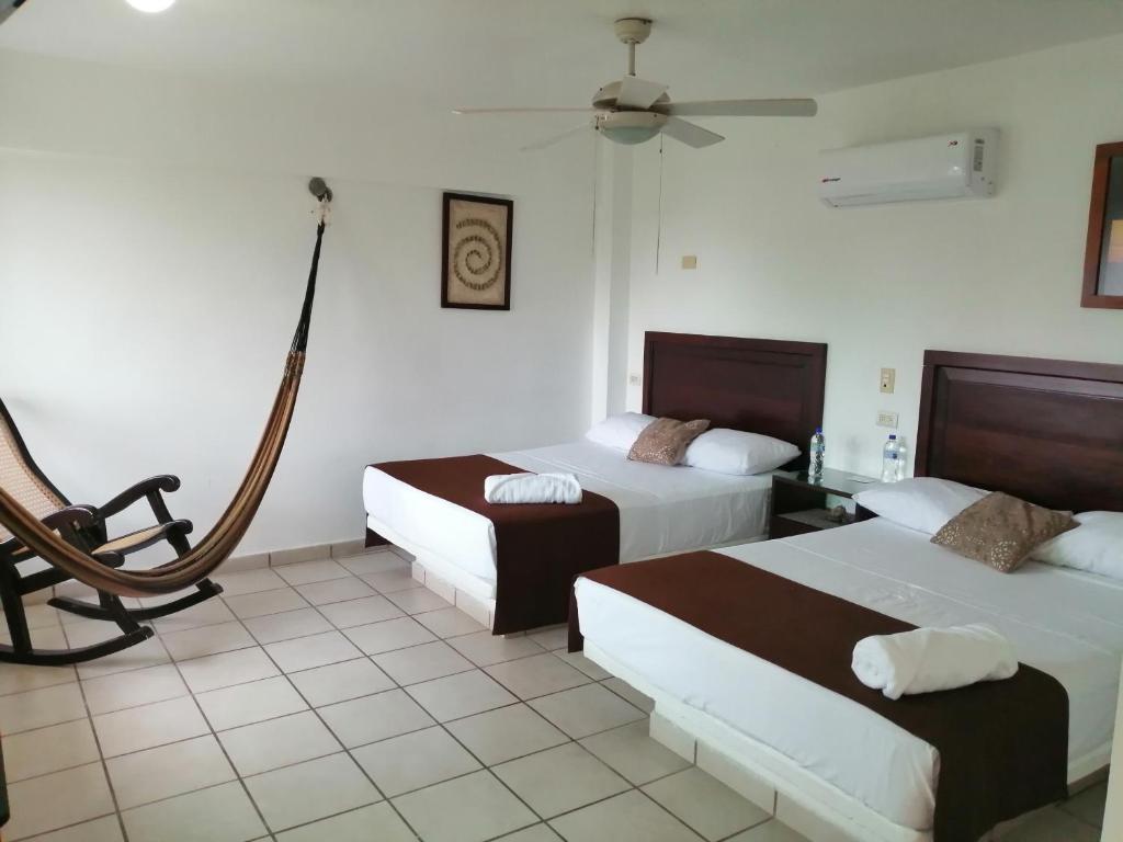 Двухместный (Двухместный номер с 2 двуспальными кроватями) отеля Hotel Arrecife Chachalacas, Чачалакас