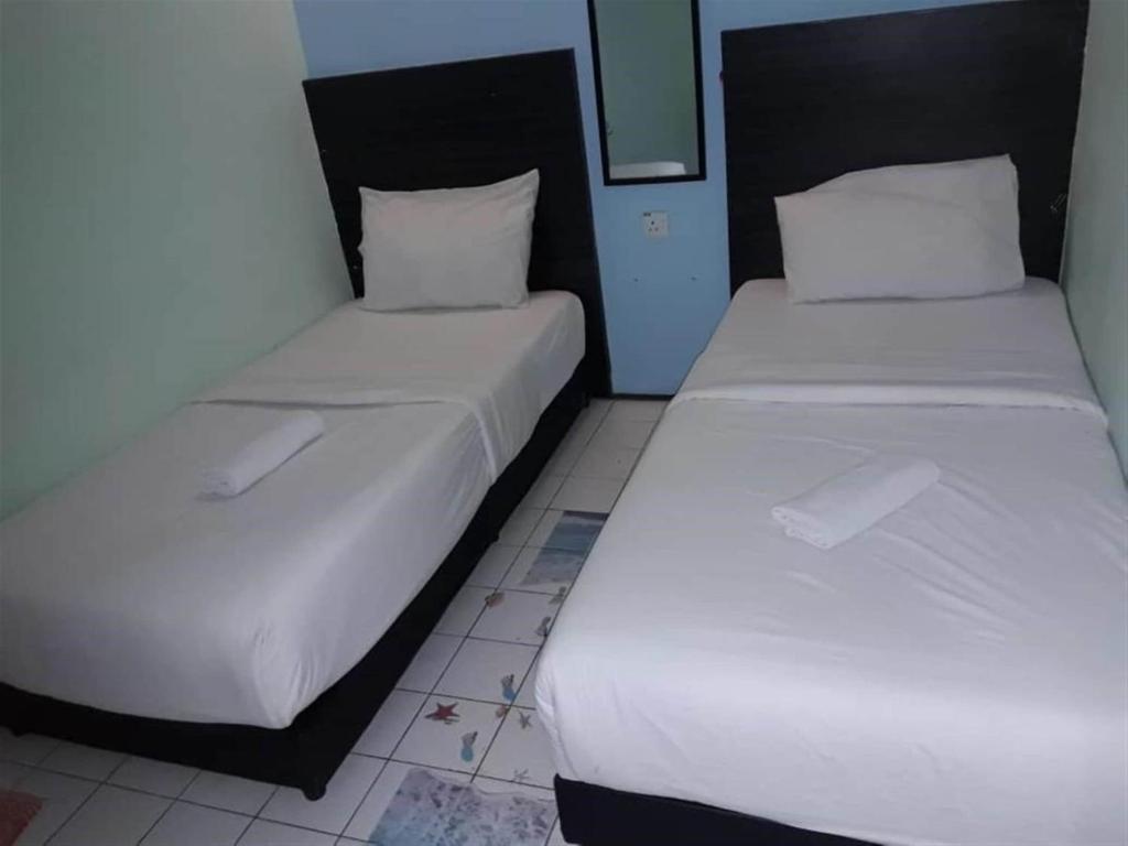 Двухместный (Стандартный двухместный номер с 2 отдельными кроватями) отеля SPOT ON 89698 Budget Inn Hotel, Куала-Лумпур