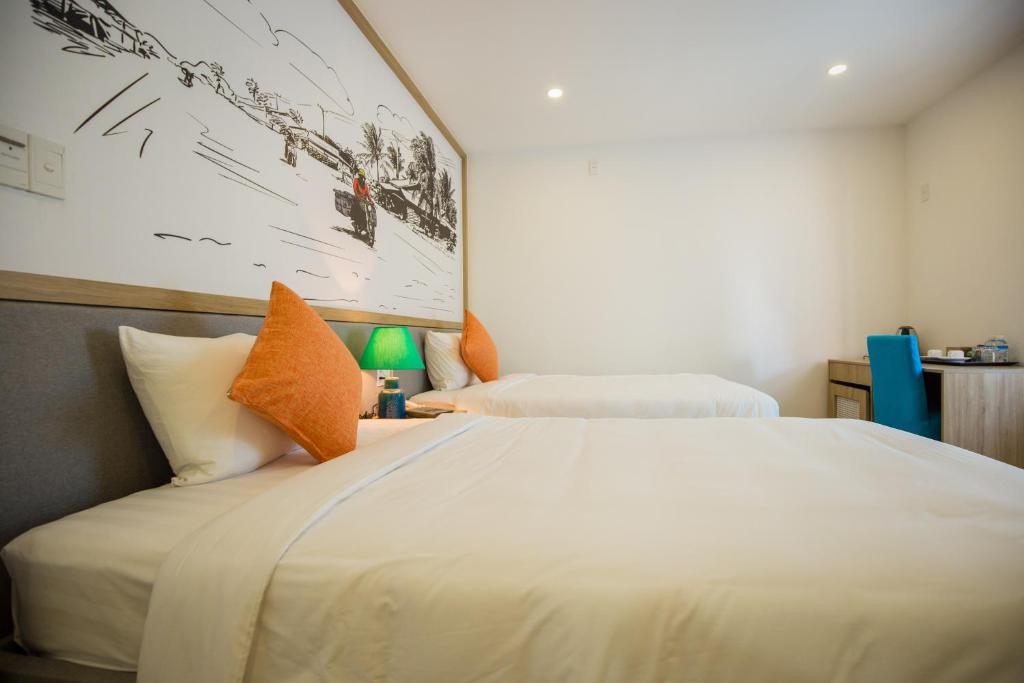 Двухместный (Улучшенный двухместный номер с 2 отдельными кроватями) отеля Hoang Quan Hotel, Дананг