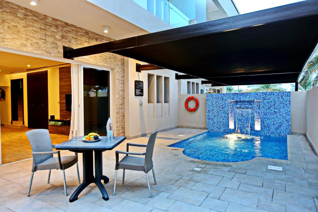 Вилла (Вилла с 3 спальнями и бассейном, вид на курорт) курортного отеля Simaisma A Murwab Resort, Сумайсимах