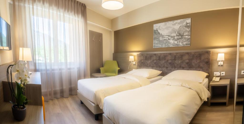 Двухместный (Двухместный номер «Комфорт» с 2 отдельными кроватями) отеля Hotel Unione, Беллинцона