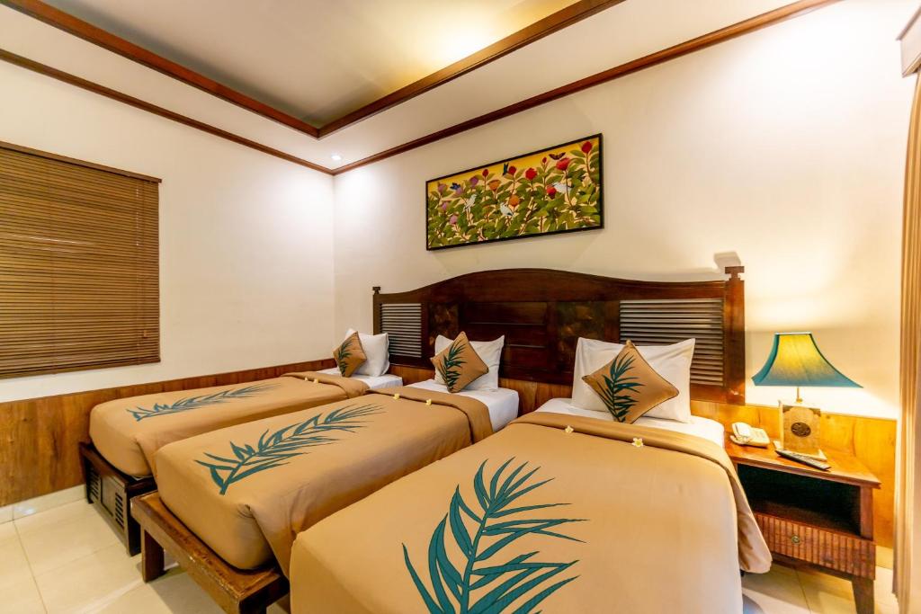 Трехместный (Трехместный номер эконом-класса) курортного отеля De Munut Balinese Resort, Убуд