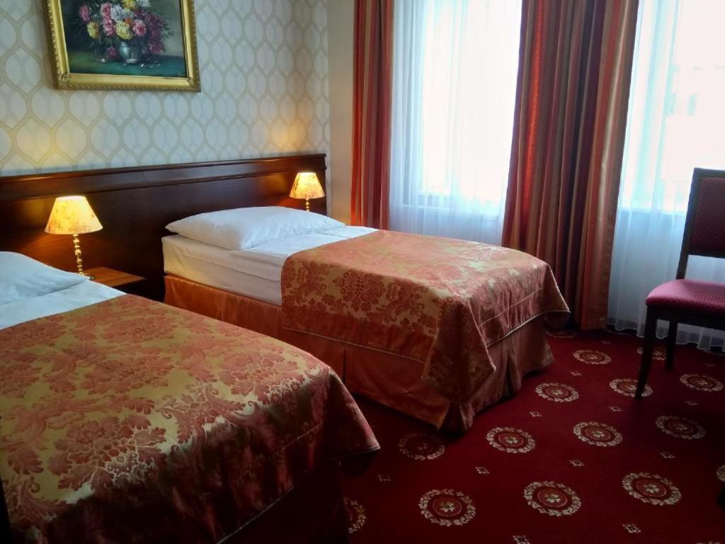 Двухместный (Стандартный двухместный номер с 2 отдельными кроватями) отеля Hotel Kopernik, Цехоцинек