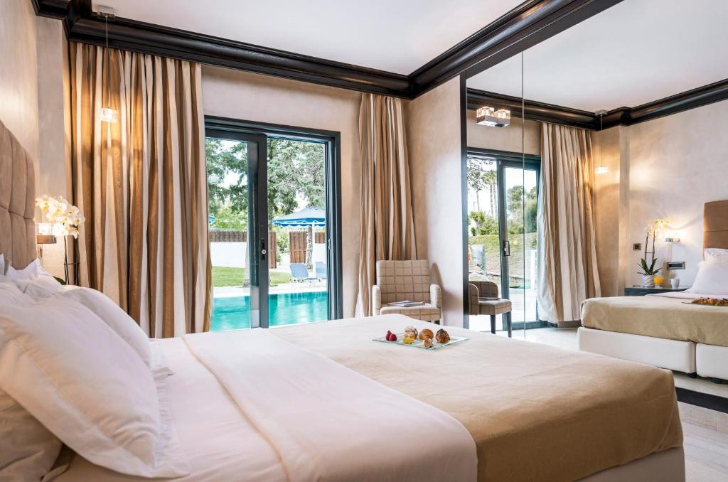 Двухместный (Двухместный номер с 2 отдельными кроватями и общим бассейном) курортного отеля Mitsis Faliraki Beach, Фалираки