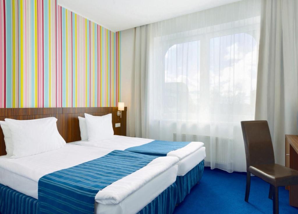 Двухместный (Стандартный двухместный номер с 1 кроватью или 2 отдельными кроватями) отеля Days Hotel Riga, Рига