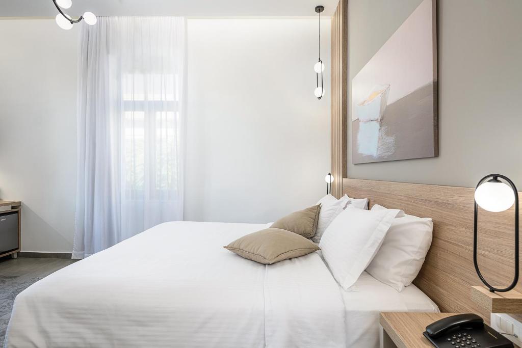 Двухместный (Улучшенный двухместный номер с 1 кроватью или 2 отдельными кроватями и террасой) отеля Epavli Boutique Hotel, Ханья