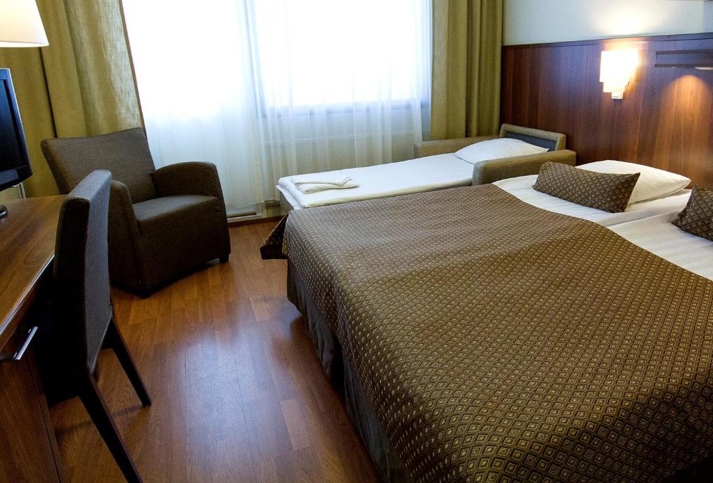 Двухместный (Двухместный номер с 2 отдельными кроватями и дополнительной кроватью, доступ в спа-центр) отеля Spa Hotel Rauhalahti, Куопио