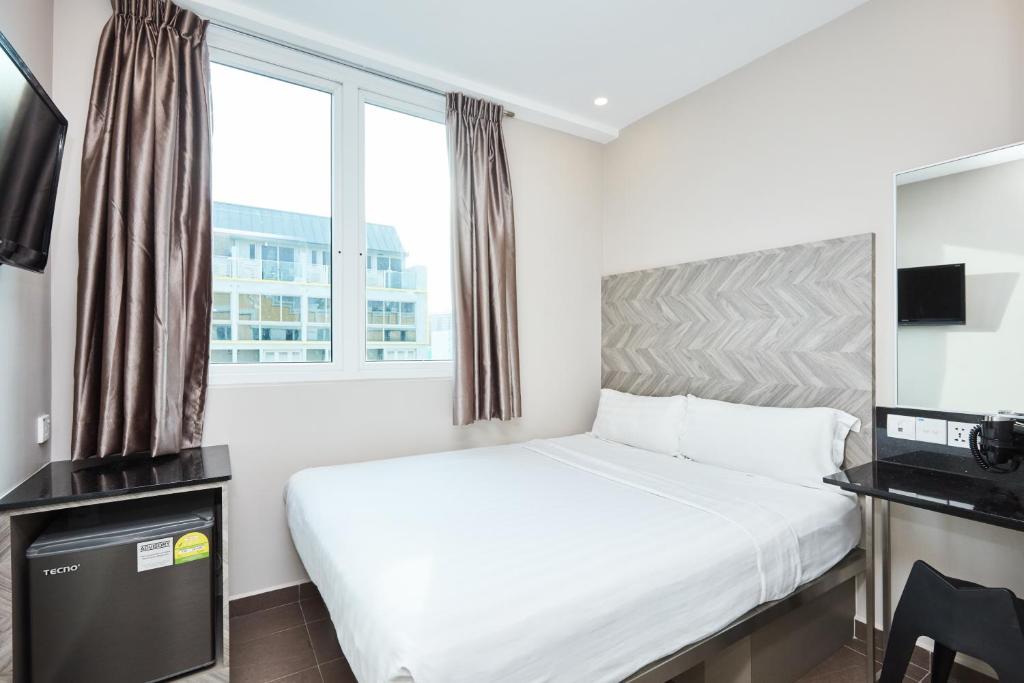 Двухместный (Двухместный номер Делюкс с 1 кроватью) отеля Fragrance Hotel - Ruby, Сингапур (город)