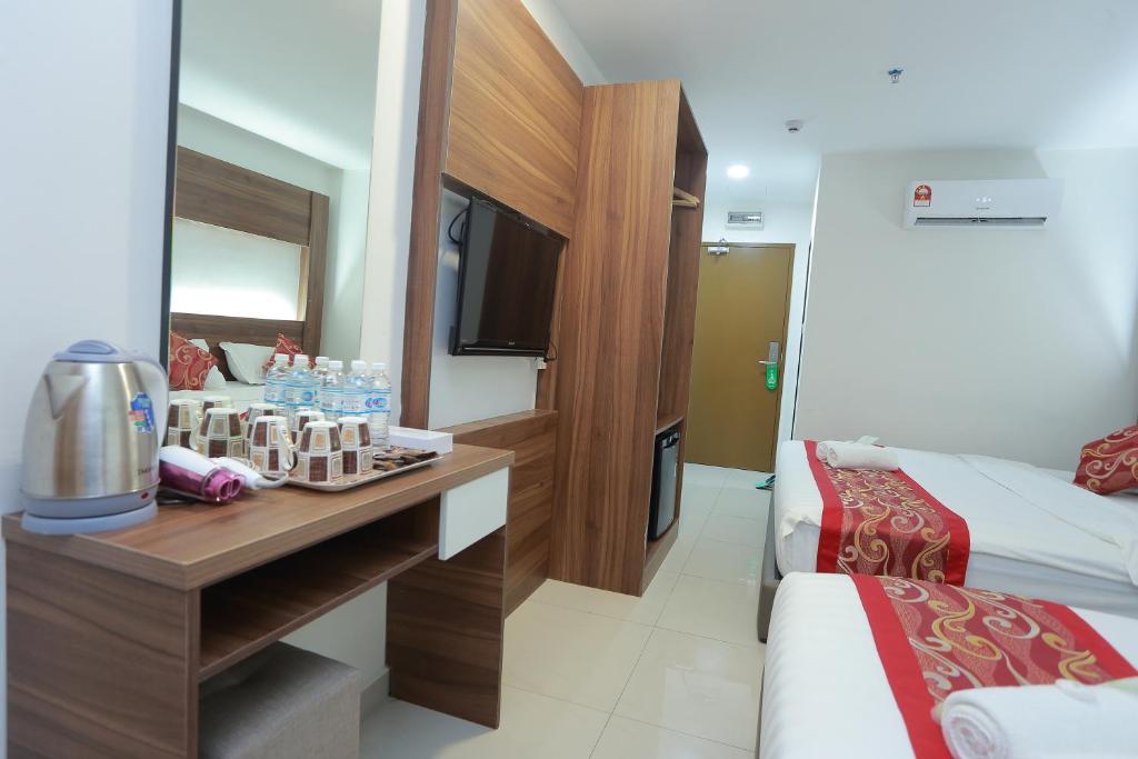 Четырехместный (Четырехместный номер Делюкс) отеля Bitz Bintang Hotel, Куала-Лумпур