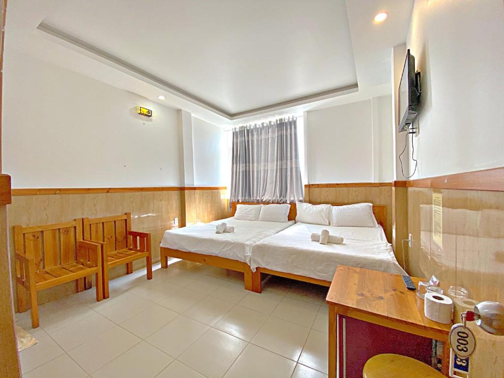 Двухместный (Большой двухместный номер с 1 кроватью или 2 отдельными кроватями) отеля Hotel Minh Hang, Фантхьет