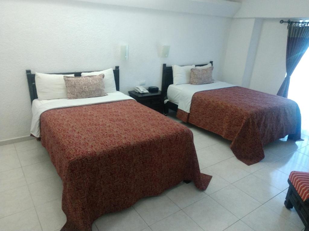 Двухместный (Стандартный двухместный номер с 2 двуспальными кроватями) отеля Hotel Maya Tabasco, Вильяэрмоса
