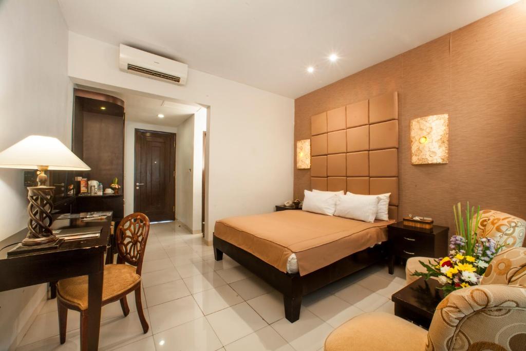Двухместный (Улучшенный двухместный номер с 1 кроватью или 2 отдельными кроватями - Бесплатный трансфер из аэропорта) отеля The Radiant Hotel & Spa, Кута