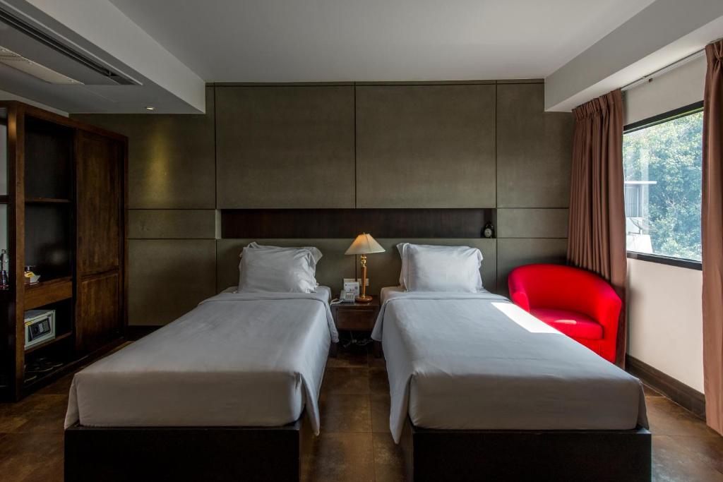 Двухместный (Улучшенный двухместный номер с 2 отдельными кроватями) отеля Nanda Heritage, Бангкок