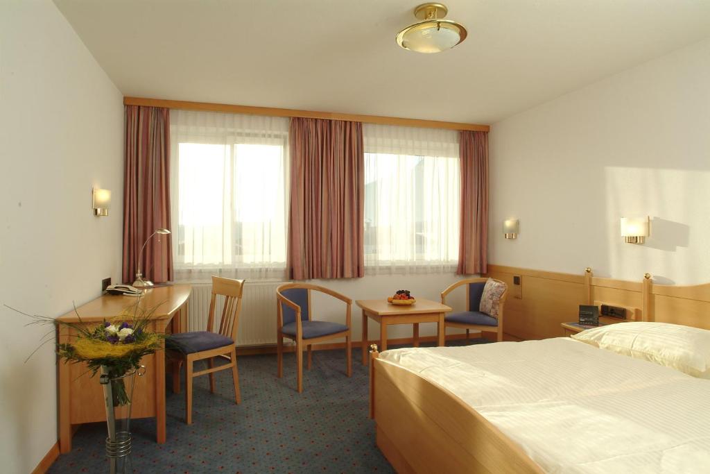 Одноместный (Двухместный номер с 1 кроватью (для 1 взрослого)) отеля Airporthotel Salzburg - Hotel am Salzburg Airport, Зальцбург