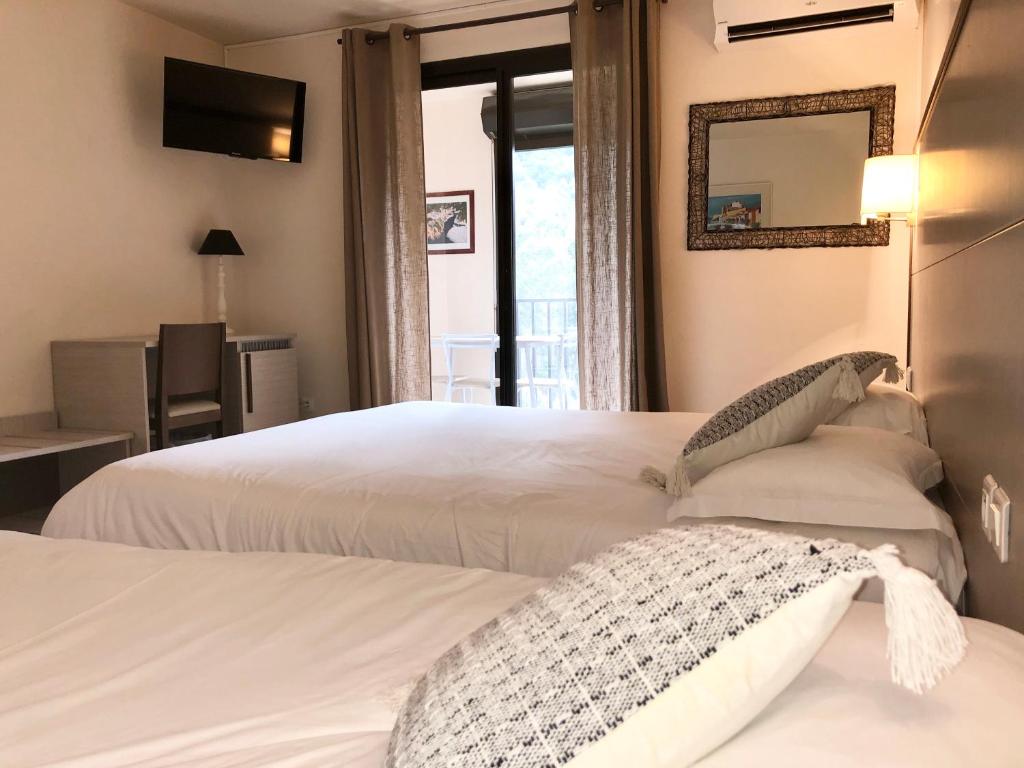 Двухместный (Двухместный номер с 1 кроватью или 2 отдельными кроватями) отеля Hotel et Résidence Cala di sole, Порто