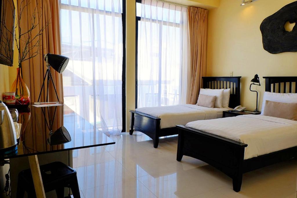 Двухместный (Двухместный номер с 2 отдельными кроватями и балконом) отеля Luxx Boutique Boracay, Боракай