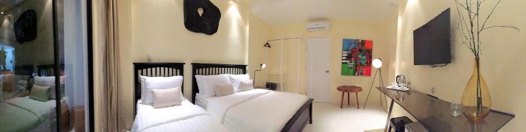 Двухместный (Просторный двухместный номер с 2 отдельными кроватями) отеля Luxx Boutique Boracay, Боракай