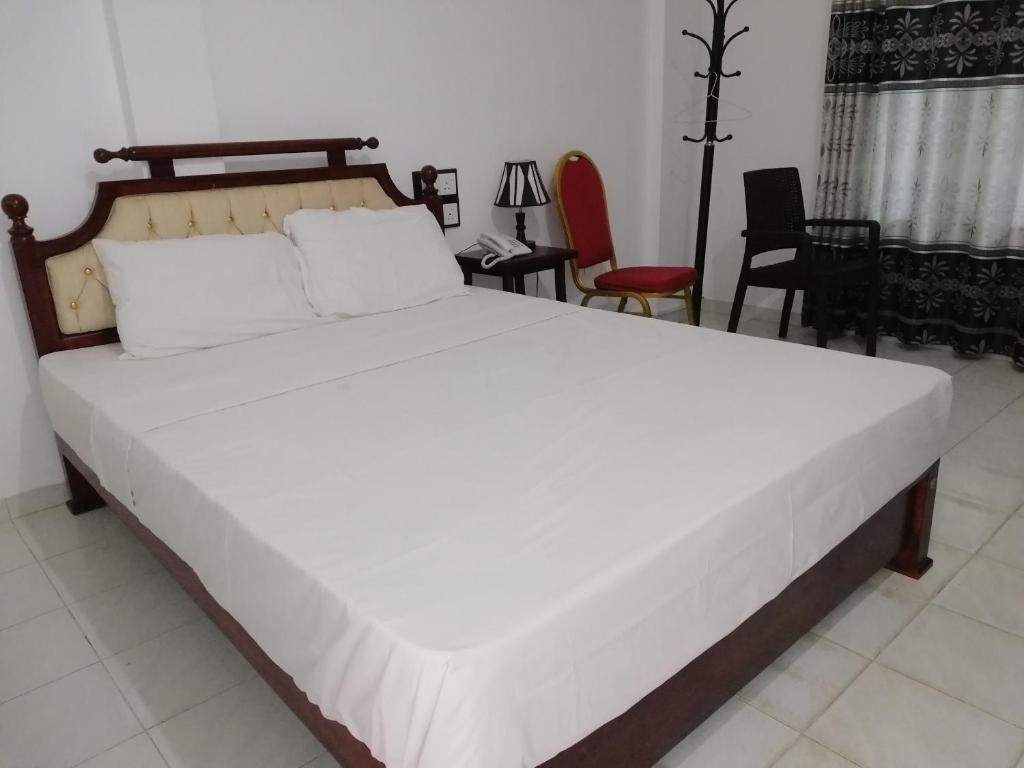 Двухместный (Стандартный двухместный номер с 2 отдельными кроватями) отеля Sarathchandra Guest House, Эмбилипития