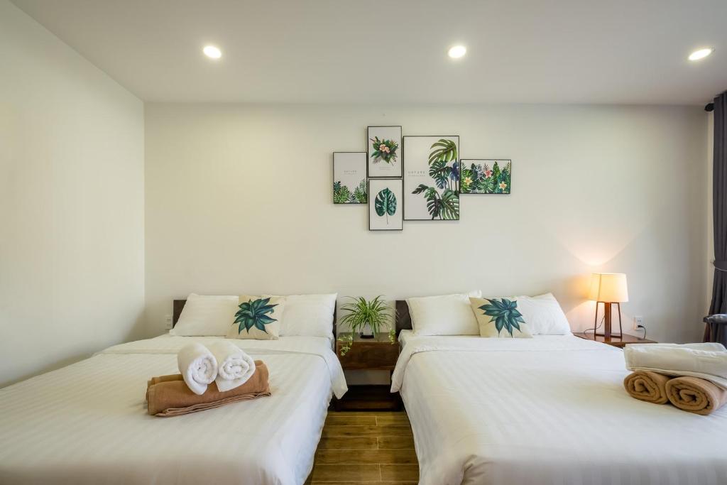 Четырехместный (Двухместный номер с 2 отдельными кроватями и видом на озеро) отеля Melica Resort, Дуонг-Донг