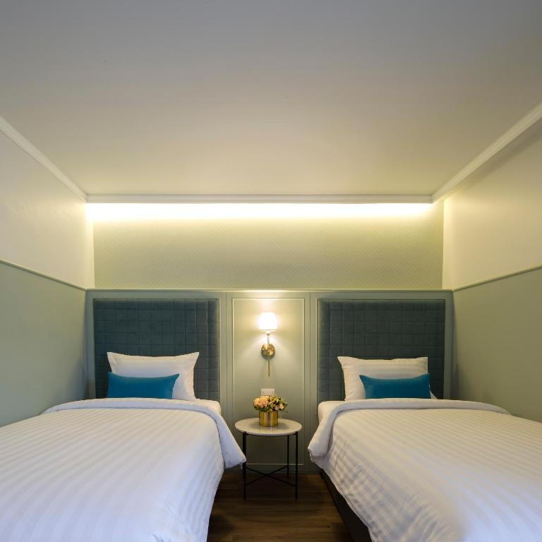 Двухместный (Двухместный номер Делюкс с 2 отдельными кроватями) отеля Rikka Inn, Бангкок