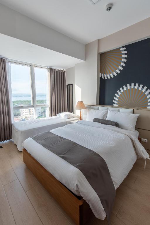 Сьюит (Двухместный люкс с 2 отдельными кроватями), C Suites at Mactan Newtown