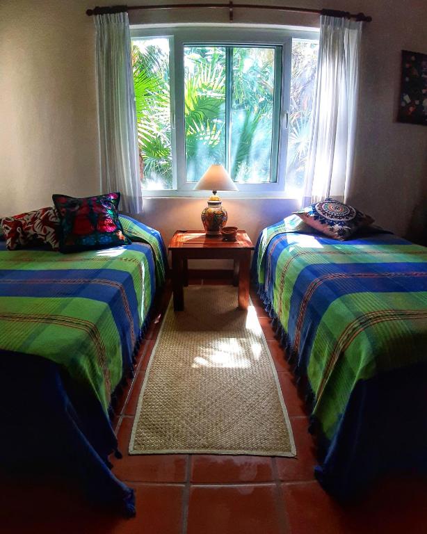 Трехместный (Трехместный номер, вид на сад) отеля Casa Kin33 Nice Room Healthy Breakfast, Канкун