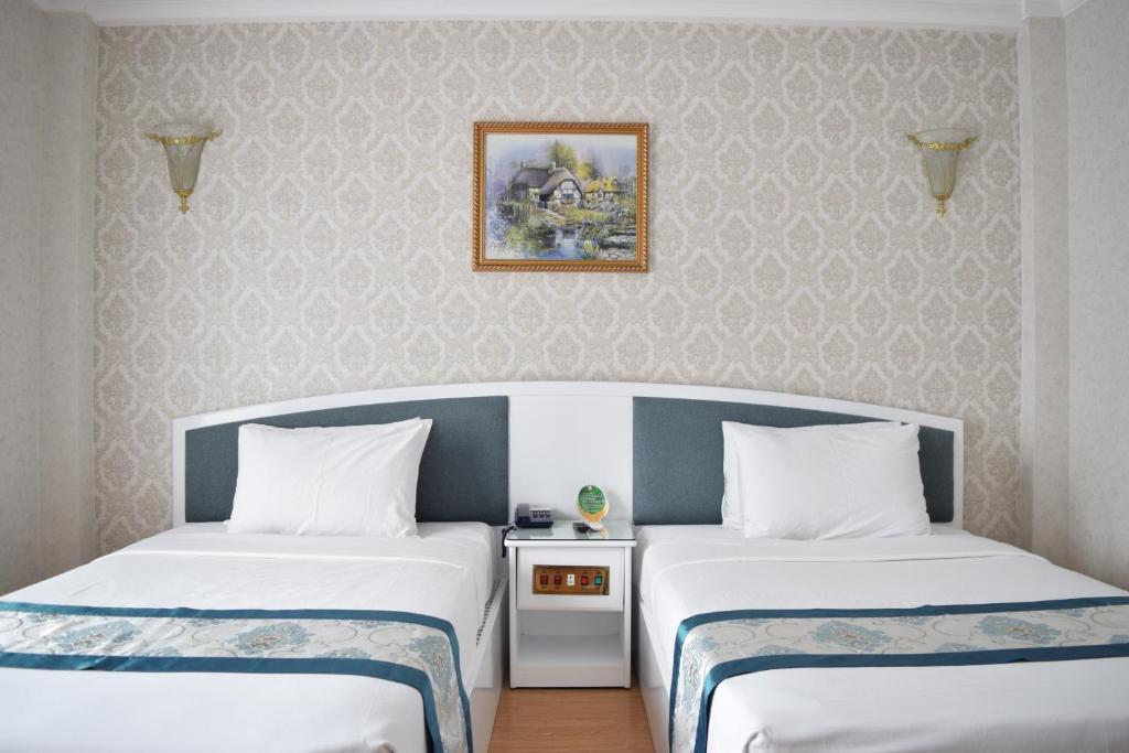 Двухместный (Улучшенный двухместный номер с 2 отдельными кроватями) отеля Rang Dong Hotel, Хошимин
