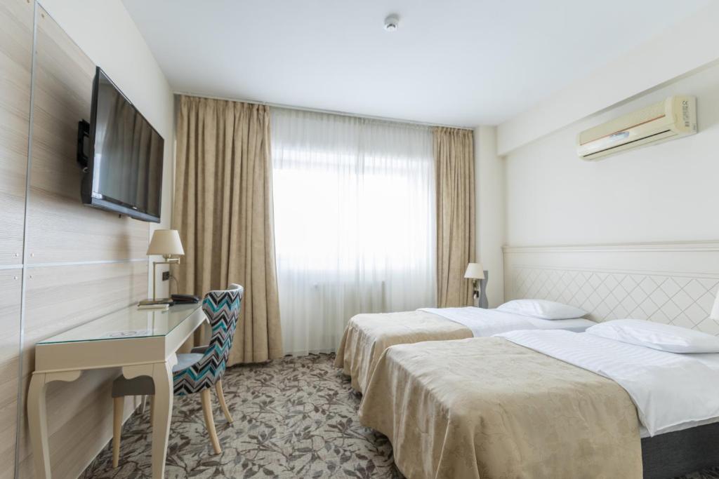 Двухместный (Стандартный двухместный номер с 2 отдельными кроватями) семейного отеля Siqua Hotel, Бухарест