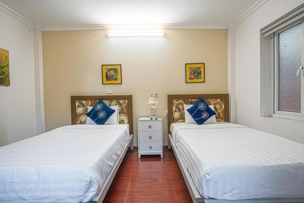 Двухместный (Улучшенный двухместный номер с 2 отдельными кроватями) отеля Miah Boutique Homestay, Ханой