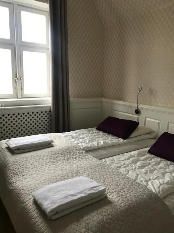 Двухместный (Двухместный номер с 2 отдельными кроватями и общей ванной комнатой) хостела Halmstad Hotell & Vandrarhem Kaptenshamn, Хальмстад