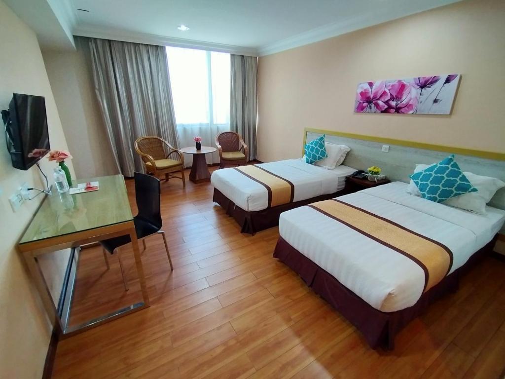 Двухместный (Двухместный номер Делюкс с 2 отдельными кроватями) отеля TD Plaza Hotel, Кота-Кинабалу