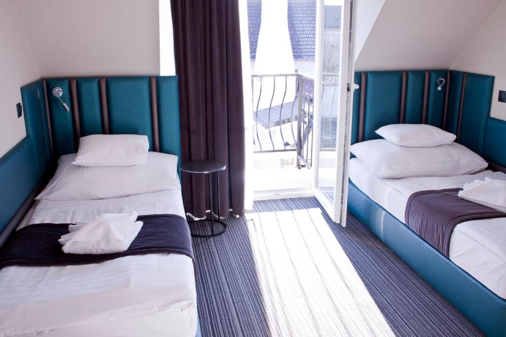 Двухместный (Двухместный номер с 2 отдельными кроватями и собственной ванной комнатой) отеля Relax Panzió, Дьёр