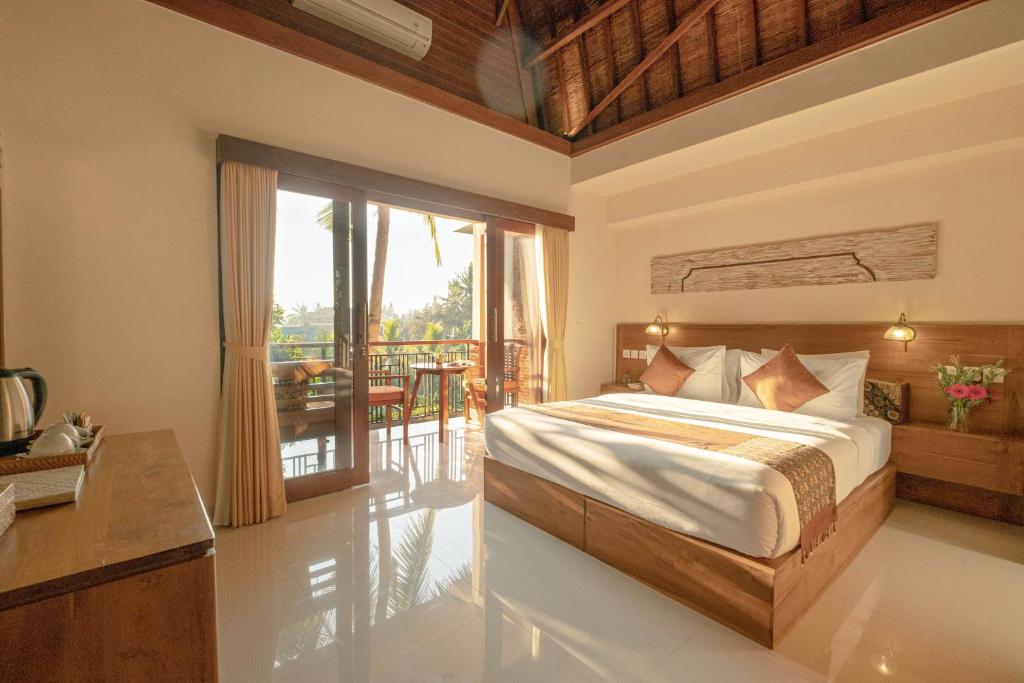 Двухместный (Улучшенный двухместный номер с 1 кроватью или 2 отдельными кроватями и видом на сад) парк-отеля Gunung Merta Bungalows, Убуд
