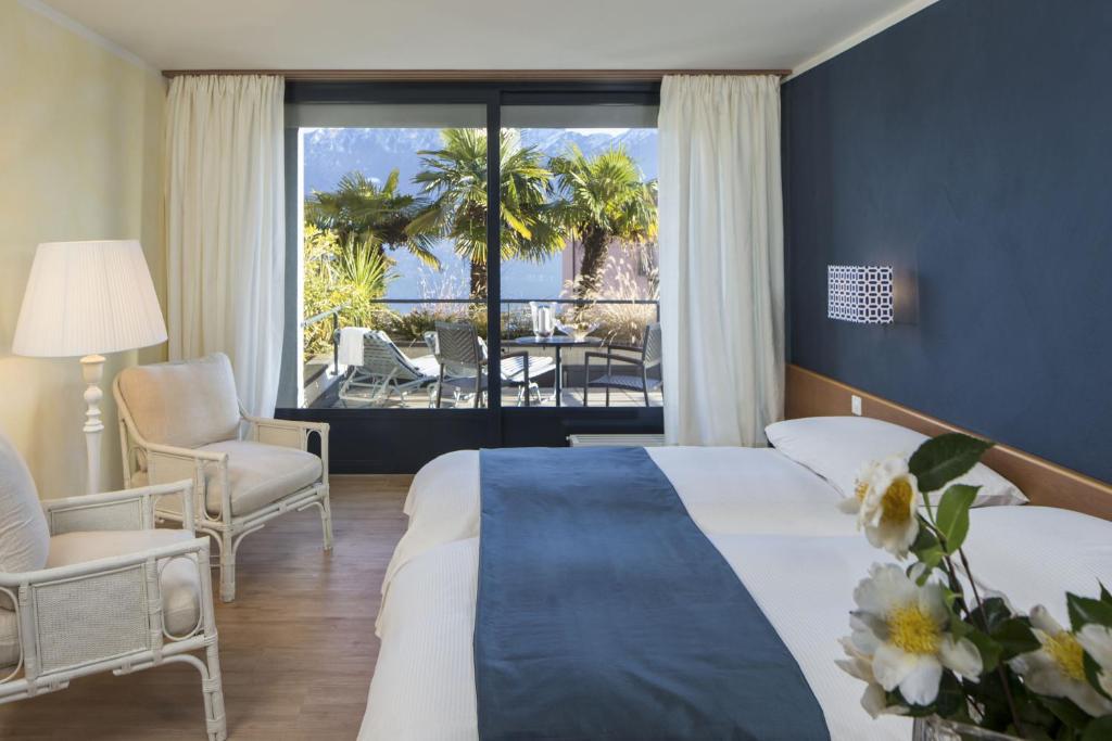Двухместный (Улучшенный двухместный номер с 1 кроватью) отеля La Barca Blu, Локарно