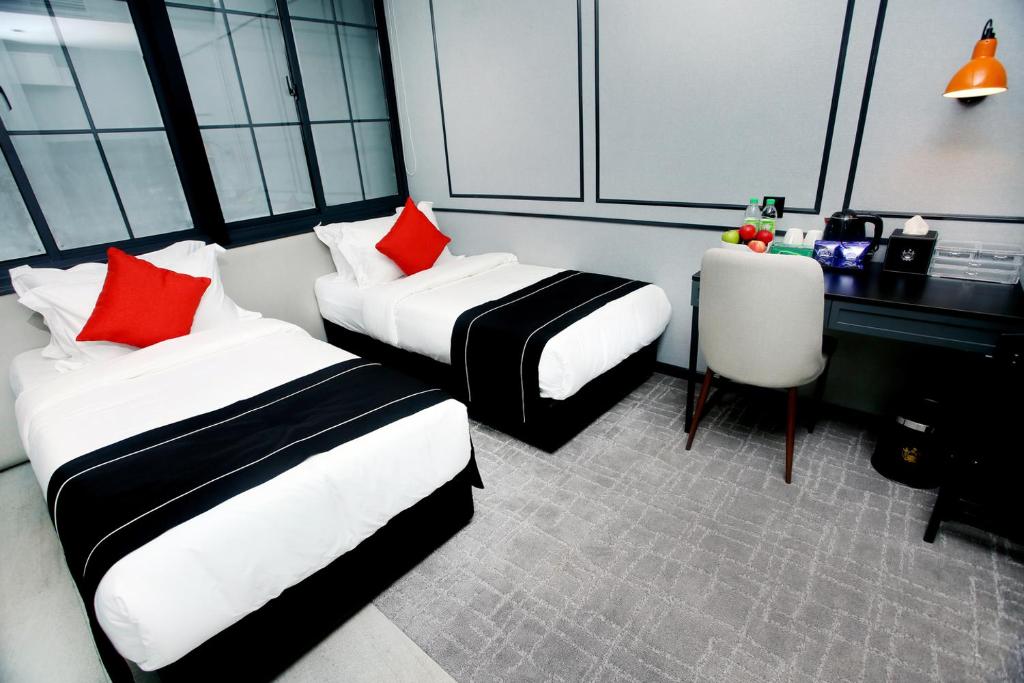 Двухместный (Улучшенный двухместный номер с 2 отдельными кроватями) отеля Stanton Hotel, Кота-Кинабалу