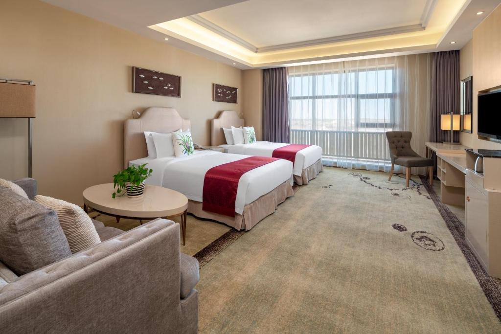 Двухместный (Двухместный номер Делюкс с 2 отдельными кроватями) курортного отеля Holiday Inn & Suites Hulunbuir, Хулун-буир