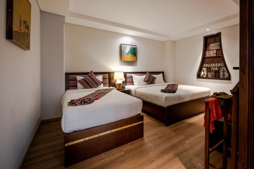 Двухместный (Люкс с 1 кроватью или 2 отдельными кроватями, вид на город) отеля Au Lac Hotel, Хошимин