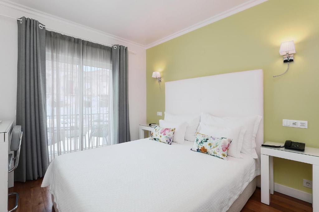 Двухместный (Двухместный номер с 1 кроватью или 2 отдельными кроватями и балконом) отеля Vila Sao Vicente Boutique Hotel (Adults Only), Албуфейра