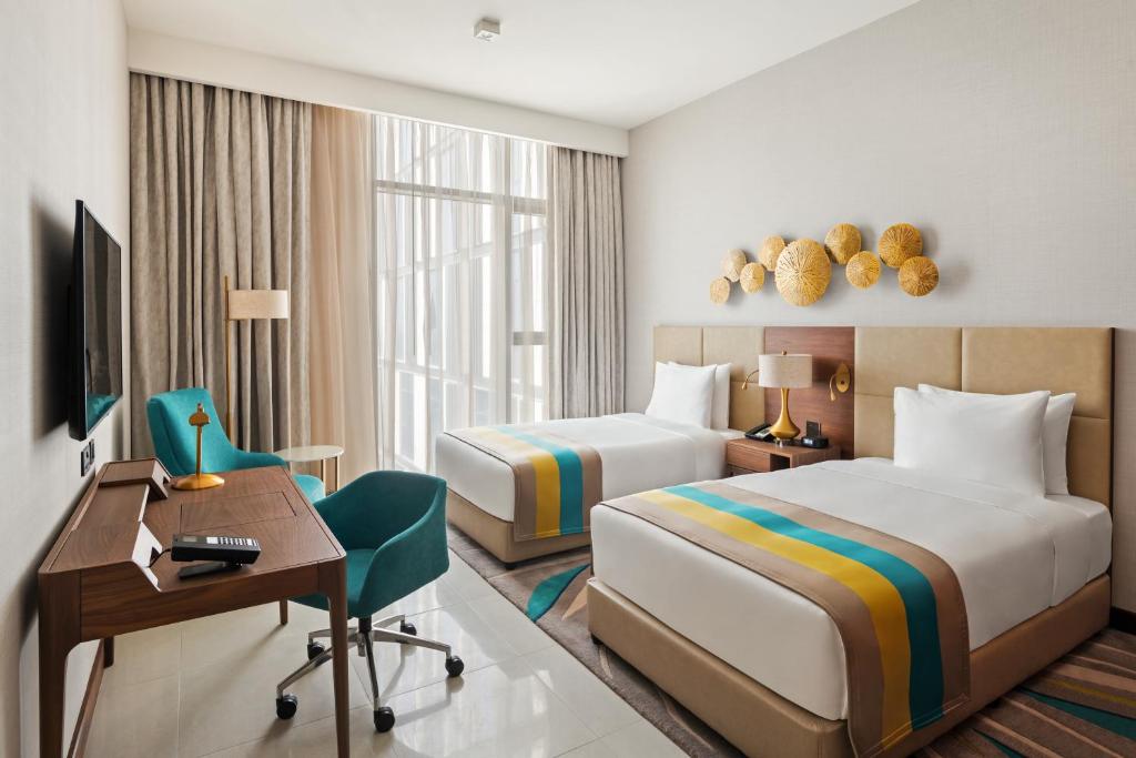 Двухместный (Номер Делюкс с кроватью размера «king-size» или 2 отдельными кроватями) отеля Holiday Inn Dubai Al-Maktoum Airport, Дубай