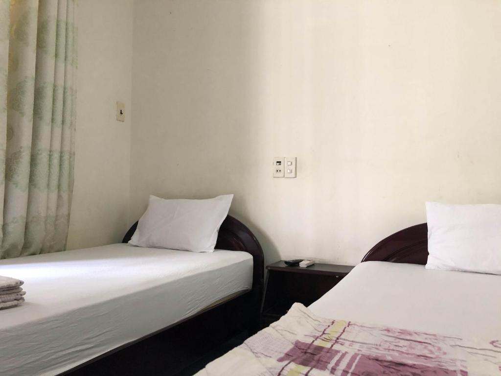 Двухместный (Стандартный двухместный номер с 2 отдельными кроватями) отеля OYO 1116 Huy Vu Motel, Нячанг