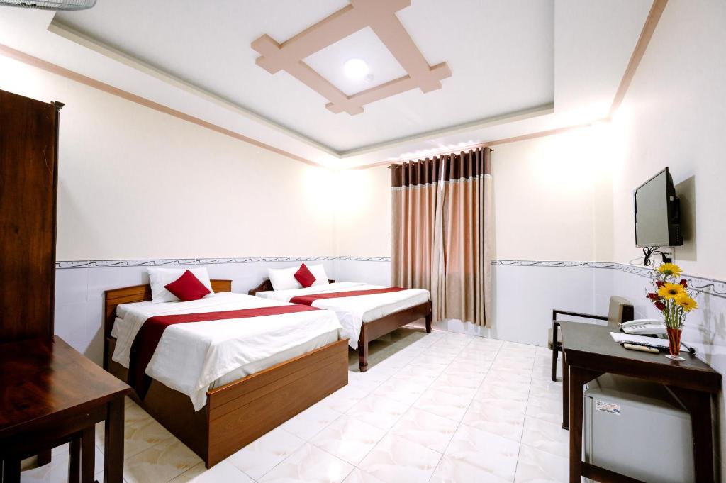 Двухместный (Стандартный двухместный номер с 2 отдельными кроватями) отеля Hoang Duc Hotel, Чаудок