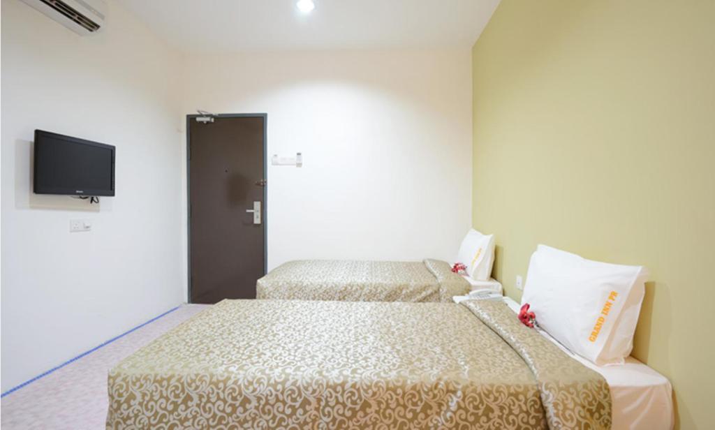 Двухместный (Стандартный двухместный номер с 2 отдельными кроватями) отеля Grand Inn - Penang Road, Джорджтаун
