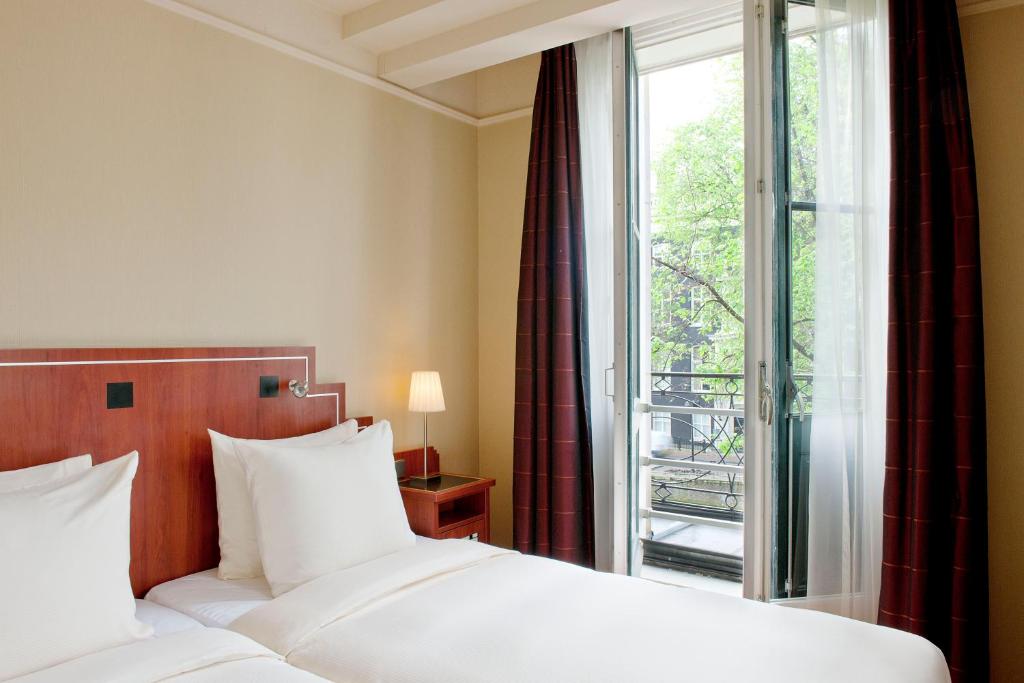 Двухместный (Двухместный номер Делюкс с 1 кроватью и видом на канал) отеля Banks Mansion Hotel - Все включено, Амстердам